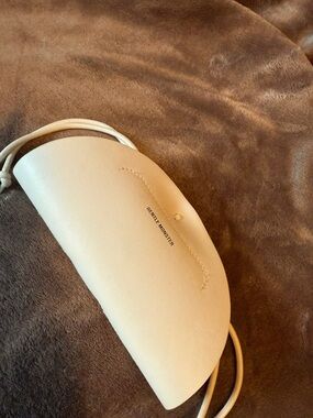 GENTLE MONSTER Cream Rounded Crossbody Clutch